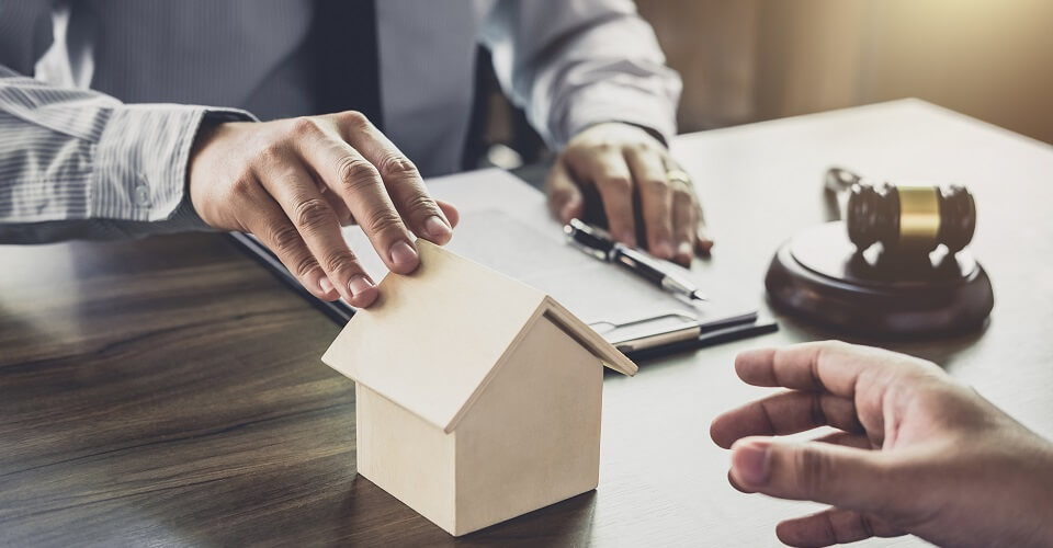 Home loan insurance, Male lawyer or judge Consult with client and working with Law books, report the case on table in office, Law and justice concept.